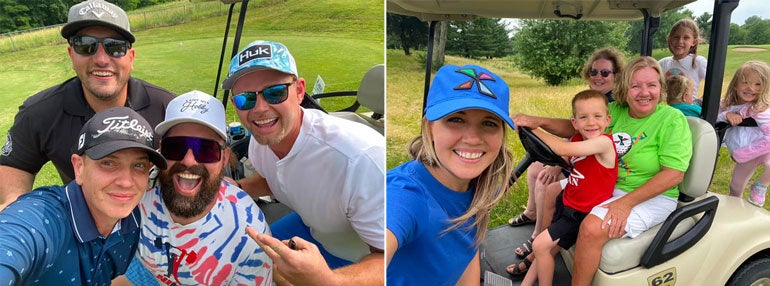 Adult and child golfers on a golf course.