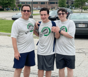 Three young men participating in X Strides.