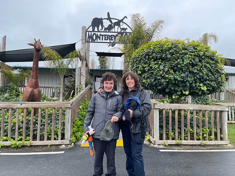 Zach and his mom in front of the Monterey Zoo entrance